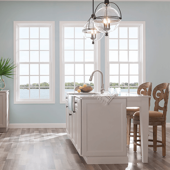 Coastal Kitchen with white trim windows