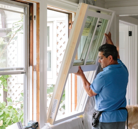 Man installing window in Buffalo, NY home