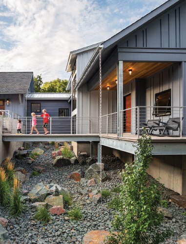 A Grey House Highlighting Marvin Ultimate Awning Exterior in New York